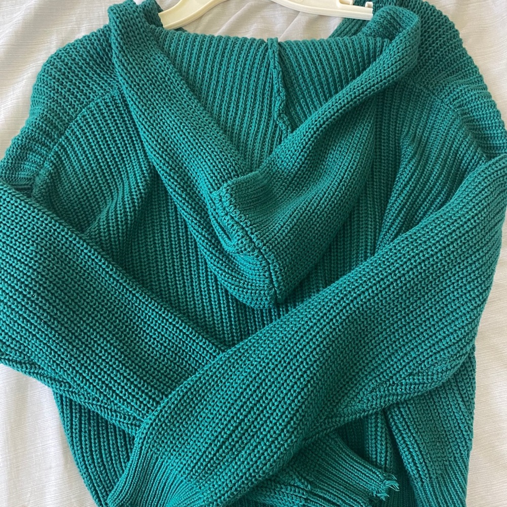 Green hooded sweater